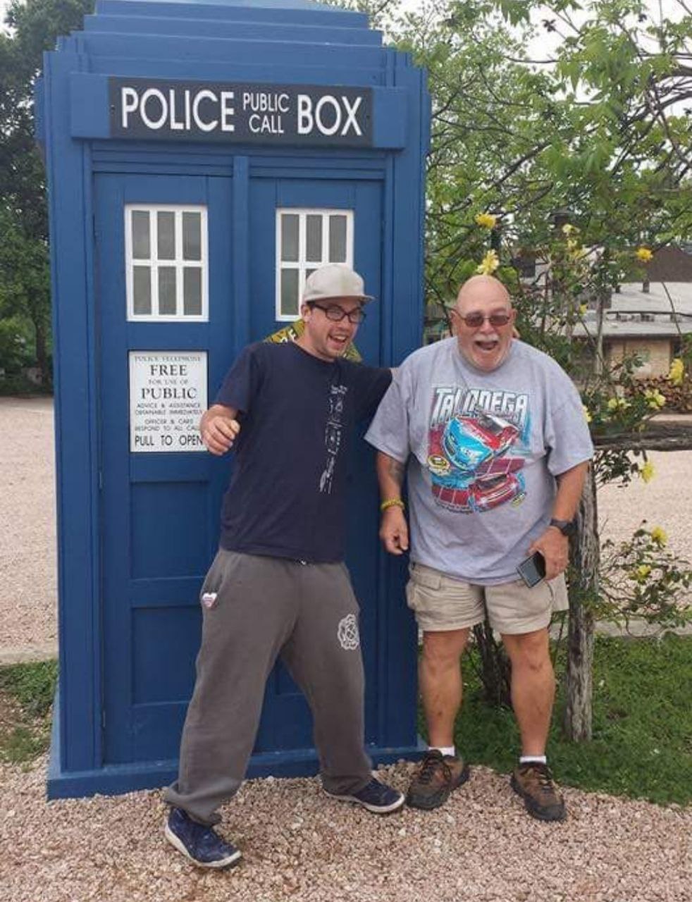 Laughing together by a blue police box prop